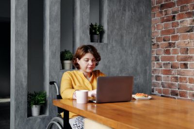 1587480497-woman-with-disability-working-from-home
